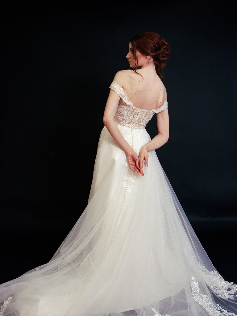 Style D2401 - Elegant off-the-shoulder Frosted Alençon Lace illusive back A-line gown